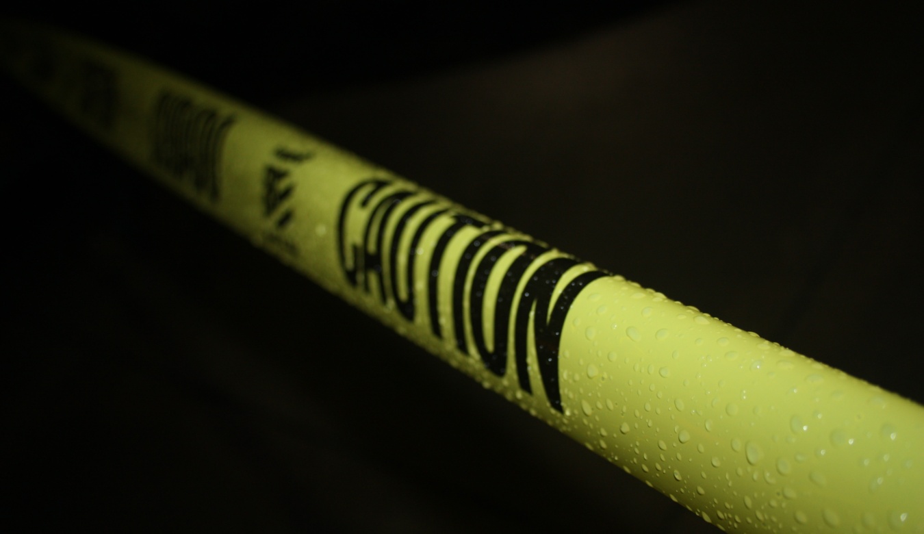 Yellow caution tape on black background